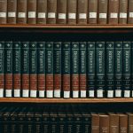 books on brown wooden shelf