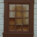 close up photo of square brown wooden window